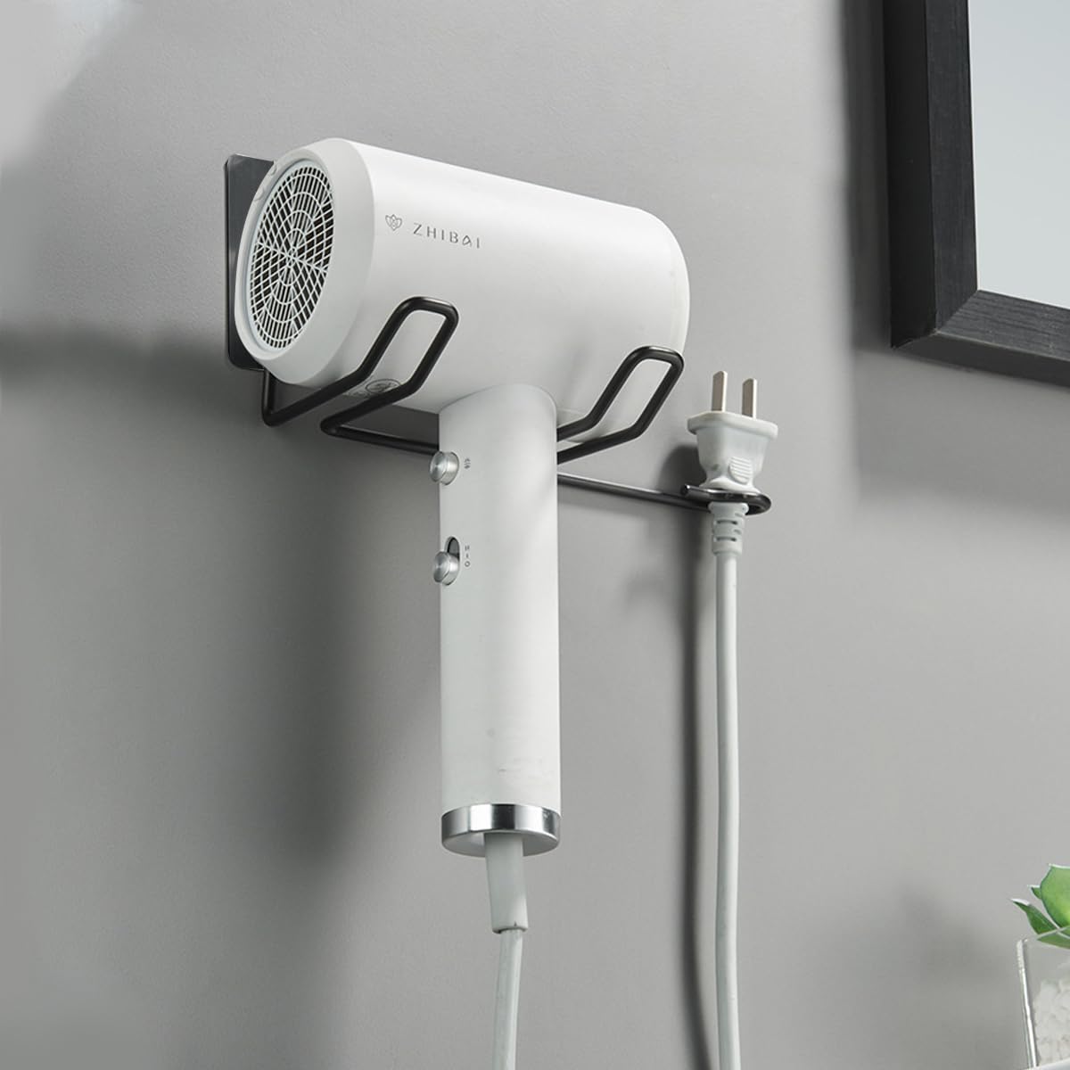 HASTHIP Hair Dryer Stand for Bathroom with Plug Holder featuring Self Adhesive Mount | Stainless Steel Wall Organizer in Black