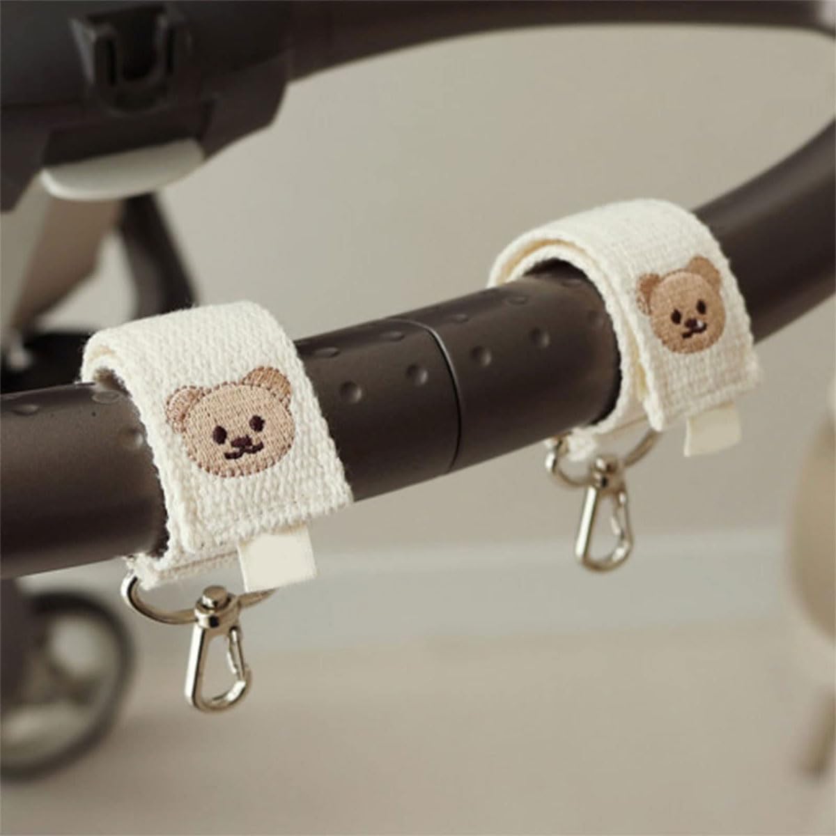 SNOWIE SOFT Baby Stroller Hooks 2 Pack with Metal Carabiner and Adjustable Cotton Straps | White Bear Design for Bags and Diapers