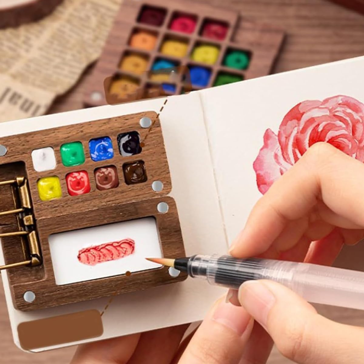 HASTHIP Pocket Watercolor Paint Set with 2.36 in Mini 8 Grid Palette and 12 Colors | Travel Sketching Kit with Brush Pen and Drawing Book