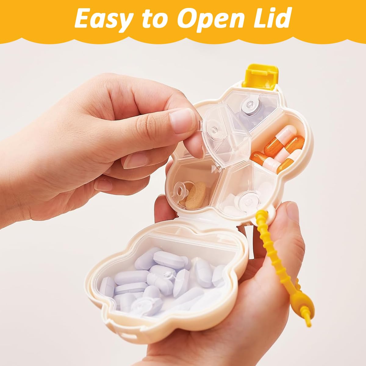 HANNEA Pill Organizer for Travel and Daily Use with 6 Compartments and Silicone Lanyard | Cream White Floral Design