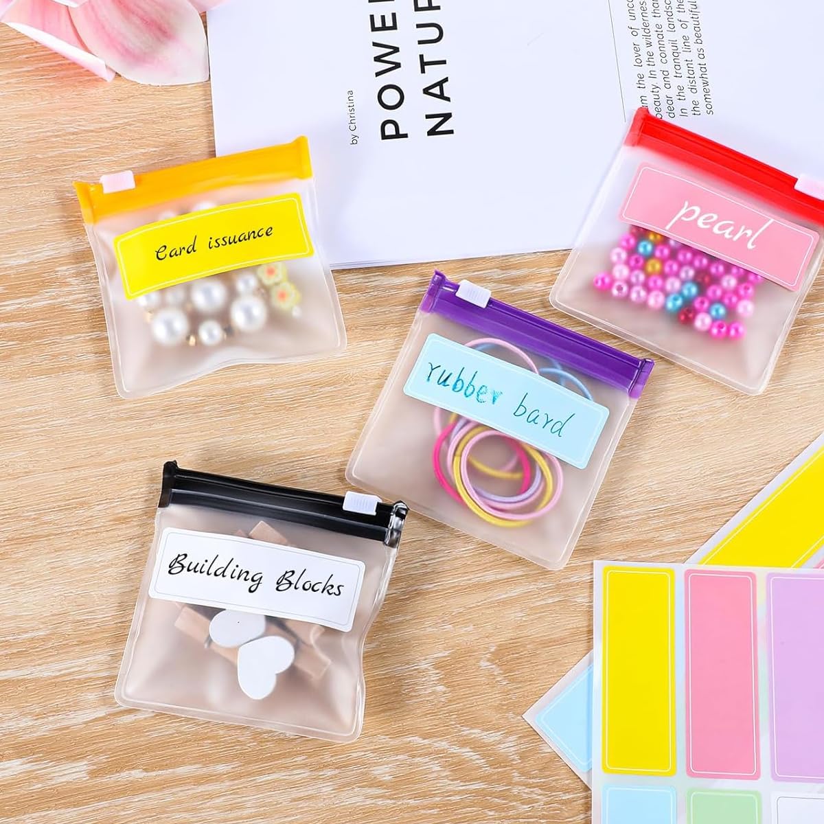 HANNEA Reusable Pill Pouch Set for Travel and Daily Use featuring 28pcs 7.6x7cm Clear EVA Bags with Color Coded Zip Lock | Includes Labels