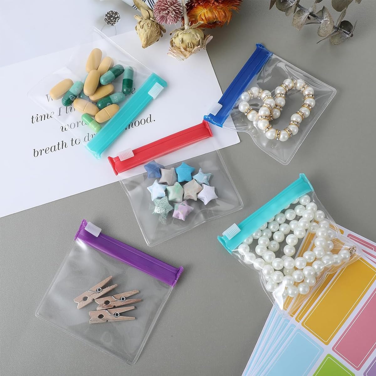 HANNEA Reusable Pill Pouch Set for Travel and Daily Use featuring 28pcs 7.6x7cm Clear EVA Bags with Color Coded Zip Lock | Includes Labels
