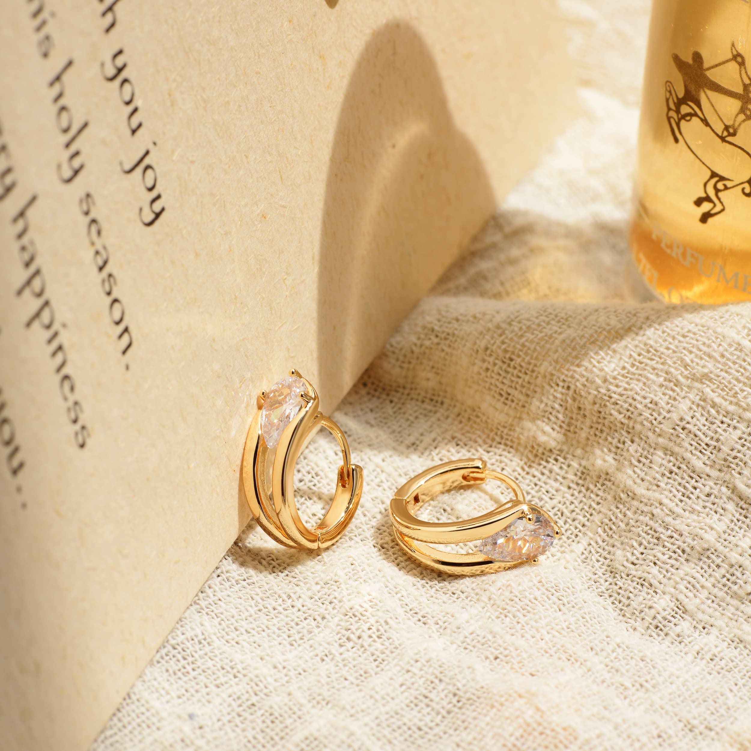 Zibuyu Bold Golden Earring for Women featuring Raindrop Cubic Zirconia and Dainty Loop Design